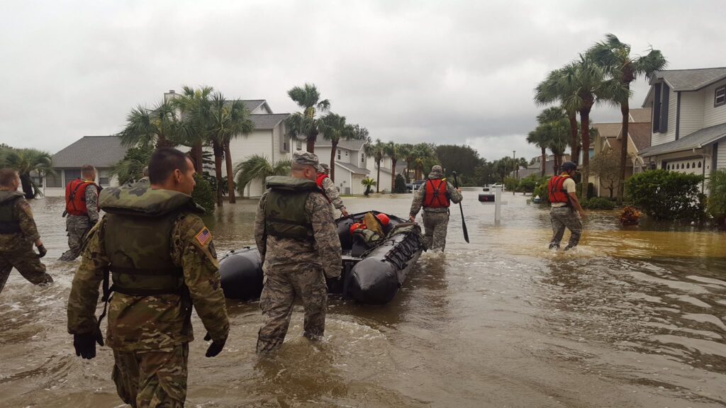 Rescue team working through flood area following hurricane. Communication breakdowns make this effort much more difficult.