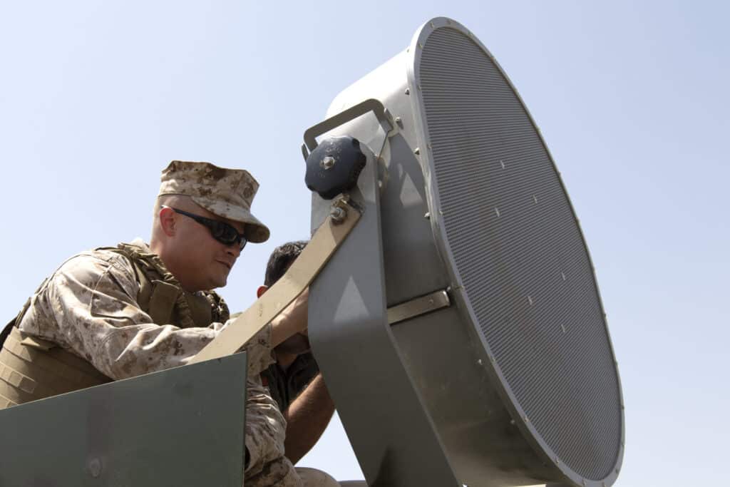 Military personnel positioning LRAD speakers.