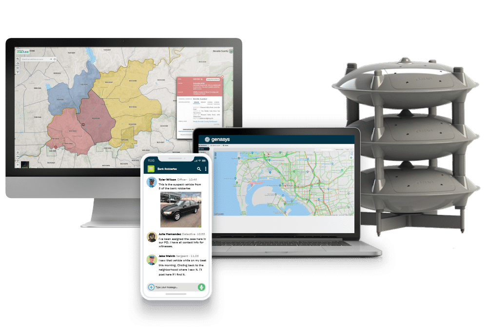 A desktop monitor, laptop, and smartphone display different map and communication apps; next to them is a stack of four gray, disc-shaped electronic devices for national warning via the National Emergency Warning System.